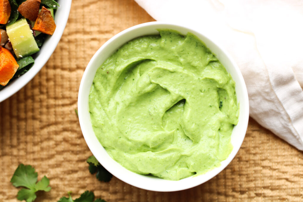 A small white bowl of whipped avocado dressing.