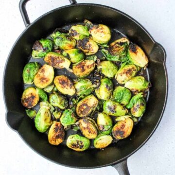 Cut brussel sprouts in a cast iron pan.
