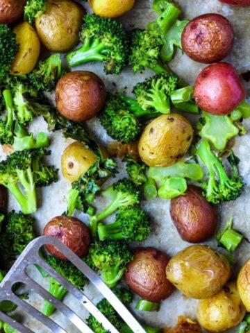 Roasted Broccoli and Potatoes on a cookie sheet.